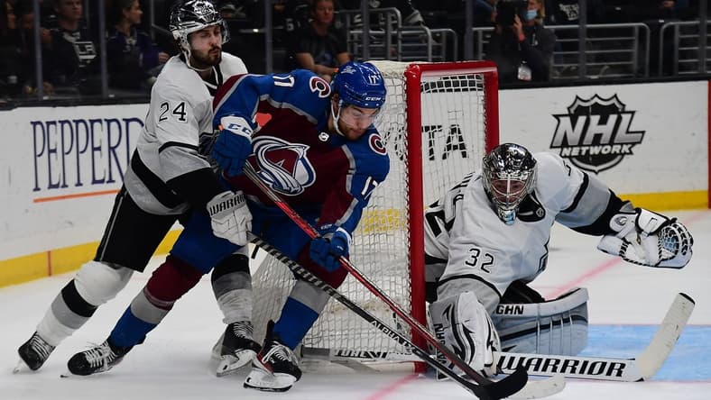 Jan 20, 2022; Los Angeles, California, USA; Colorado Avalanche center Tyson Jost (17) moves in for a shot on goal against Los Angeles Kings goaltender Jonathan Quick (32) and center Phillip Danault (24) during the third period at Crypto.com Arena. Mandatory Credit: Gary A. Vasquez-USA TODAY Sports