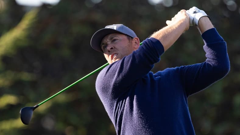 Feb 6, 2022; Pebble Beach, California, USA; Seamus Power plays his shot from the first tee during the final round of the AT&T Pebble Beach Pro-Am golf tournament at Pebble Beach Golf Links. Mandatory Credit: Bill Streicher-USA TODAY Sports