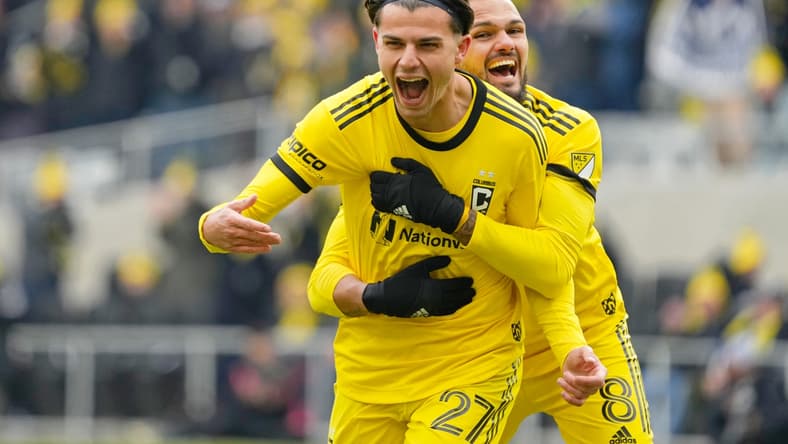 Feb 26, 2022; Columbus, OH, USA; Columbus Crew forward Miguel Berry (27) celebrates after scoring a goal against the Vancouver Whitecaps with midfielder Artur (8) during the first half at Lower.com Field. Mandatory Credit: Joshua Bickel-USA TODAY Sports