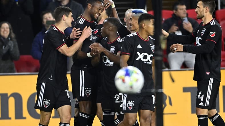 Feb 26, 2022; Washington, District of Columbia, USA; D.C. United forward Michael Estrada (7) celebrates with teammates after scoring a goal against the Charlotte FC in the first half at Audi Field. Mandatory Credit: Brad Mills-USA TODAY Sports