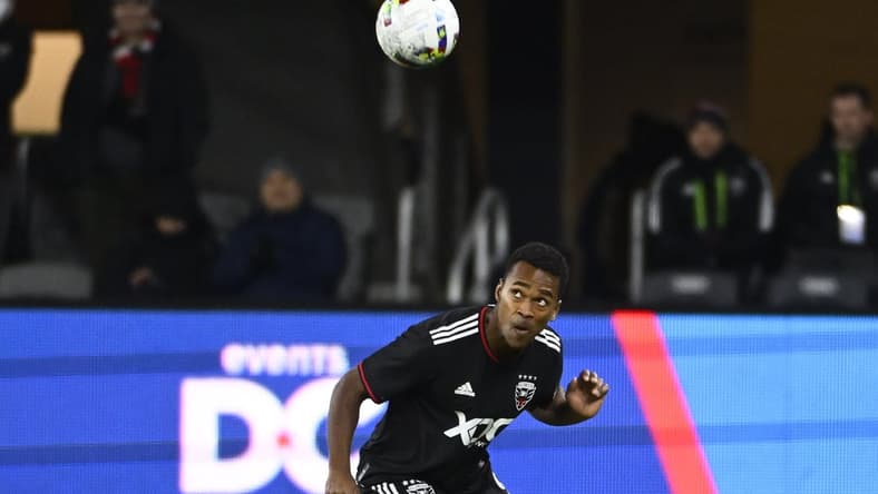 Feb 26, 2022; Washington, District of Columbia, USA; D.C. United forward Ola Kamara (9) heads the ball in the second half against the Charlotte FC  at Audi Field. Mandatory Credit: Brad Mills-USA TODAY Sports