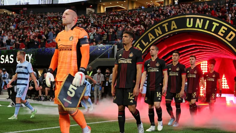 Feb 27, 2022; Atlanta, Georgia, USA; Atlanta United goalkeeper Brad Guzan (1) leads his team onto the field before the game against Sporting Kansas City at Mercedes-Benz Stadium. Mandatory Credit: Brett Davis-USA TODAY Sports
