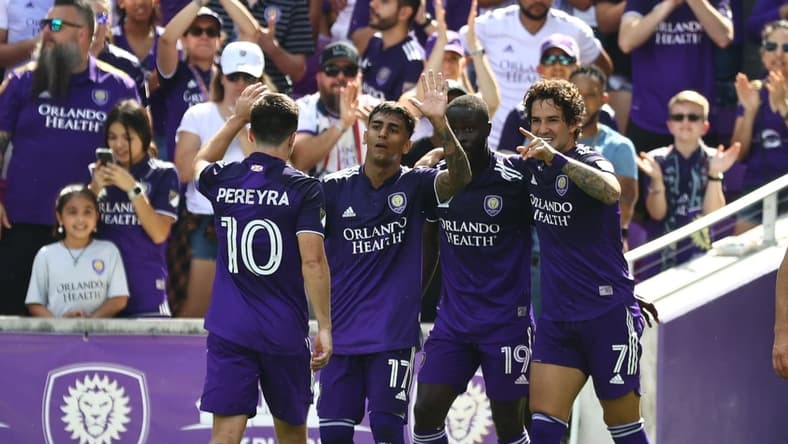 Feb 27, 2022; Orlando, Florida, USA; Orlando City SC forward Benji Michel (19) celebrates with forward Alexandre Pato (7) as he scores a goal against the CF Montr  al during the second half at Orlando City Stadium. Mandatory Credit: Kim Klement-USA TODAY Sports