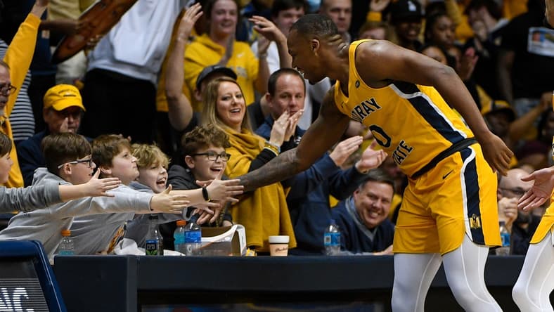 Feb 24, 2022; Murray, Kentucky, USA;  Murray State Racers forward KJ Williams (0) high fives fans as he walks down the court against the Belmont Bruins during second half at CFSB Center. Mandatory Credit: Steve Roberts-USA TODAY Sports