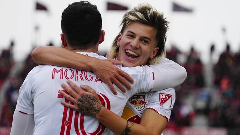 Mar 5, 2022; Toronto, Ontario, CAN; New York Red Bulls defender John Tolkin (47) congratulates midfielder Lewis Morgan (10) on his second goal of the first half against Toronto FC at BMO Field. Mandatory Credit: John E. Sokolowski-USA TODAY Sports
