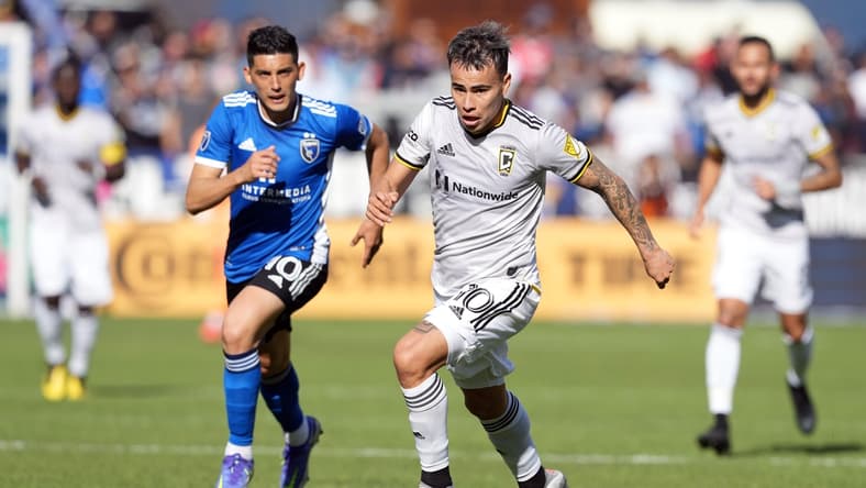 Mar 5, 2022; San Jose, California, USA; Columbus Crew midfielder Lucas Zelarayan (10) dribbles against San Jose Earthquakes forward Cristian Espinoza (10) during the first half at PayPal Park. Mandatory Credit: Darren Yamashita-USA TODAY Sports
