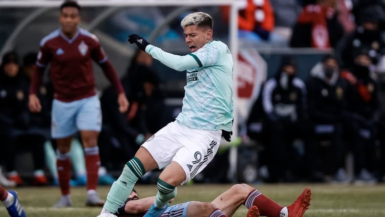 Mar 5, 2022; Commerce City, Colorado, USA; Atlanta United midfielder Matheus Rossetto (9) gets tripped up with Colorado Rapids midfielder Jack Price (19) in the first half at Dick's Sporting Goods Park. Mandatory Credit: Isaiah J. Downing-USA TODAY Sports