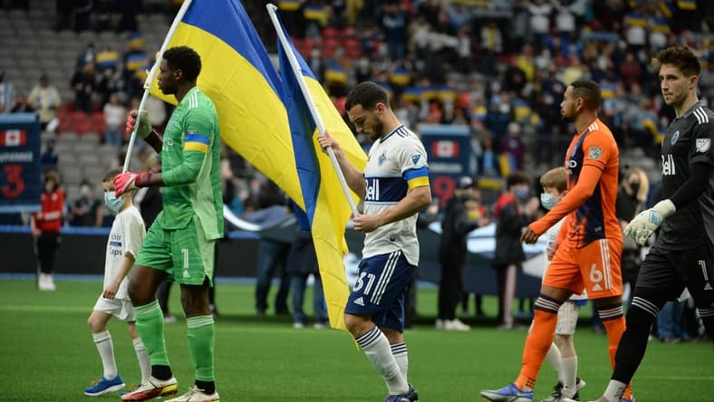 Mar 5, 2022; Vancouver, British Columbia, CAN; New York City FC goalkeeper Sean Johnson (1) and Vancouver Whitecaps forward Russell Teibert (31) walk onto the pitch before the start of the first half at BC Place. Mandatory Credit: Anne-Marie Sorvin-USA TODAY Sports
