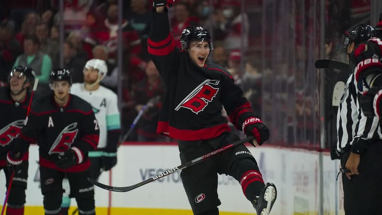 Mar 6, 2022; Raleigh, North Carolina, USA; Carolina Hurricanes center Martin Necas (88) celebrates his goal against the Seattle Kraken during the third period at PNC Arena. Mandatory Credit: James Guillory-USA TODAY Sports