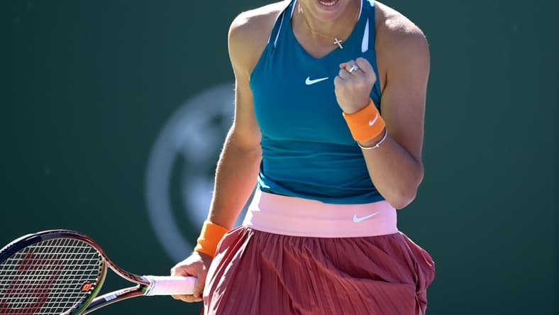 Mar 11, 2022; Indian Wells, CA, USA; Emma Raducanu (GBR) reacts after winning a point in action as she defeats Caroline Garcia (FRA) in her 2nd round match at the BNP Paribas Open at the Indian Wells Tennis Garden. Mandatory Credit: Jayne Kamin-Oncea-USA TODAY Sports