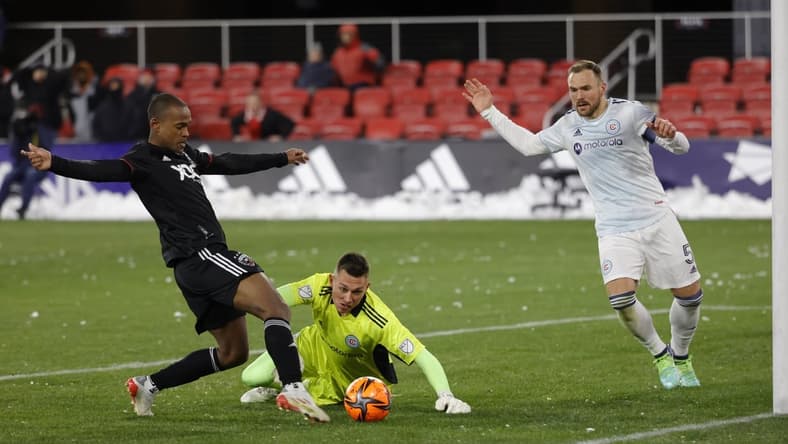 Mar 12, 2022; Washington, District of Columbia, USA; D.C. United forward Ola Kamara (9) shoots the ball on Chicago Fire goalkeeper Gabriel Slonina (1) during the first half at Audi Field. Mandatory Credit: Geoff Burke-USA TODAY Sports