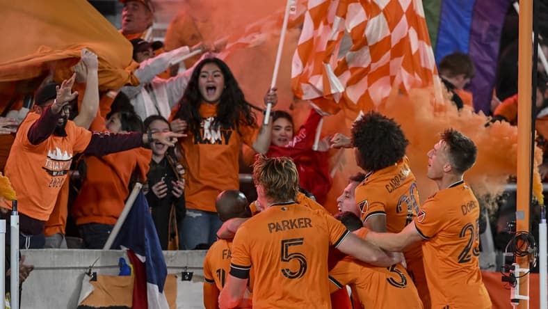 Mar 12, 2022; Houston, Texas, USA;  Houston Dynamo FC forward Darwin Quintero (23) celebrates with teammates after his second goal of the match against the Vancouver Whitecaps at PNC Stadium. Mandatory Credit: Maria Lysaker-USA TODAY Sports
