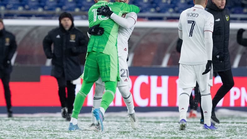 Mar 12, 2022; Foxborough, Massachusetts, USA; Real Salt Lake goalkeeper Zac MacMath (18) and forward Tate Schmitt (21) react after defeating the New England Revolution at Gillette Stadium. Mandatory Credit: Paul Rutherford-USA TODAY Sports
