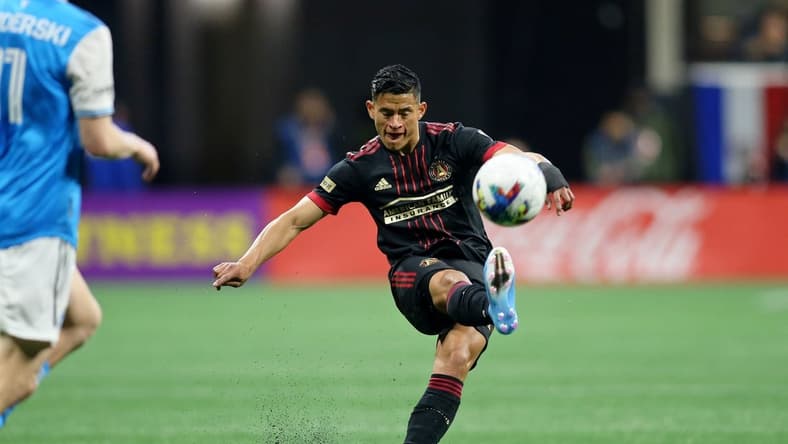 Mar 13, 2022; Atlanta, Georgia, USA; Atlanta United defender Ronald Hernandez (2) kicks the ball against Charlotte FC during the first half at Mercedes-Benz Stadium. Mandatory Credit: Brett Davis-USA TODAY Sports