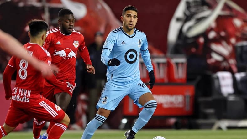 Mar 13, 2022; Harrison, New Jersey, USA;  Minnesota United midfielder Emanuel Reynoso (10) dribbles the ball against the New York Red Bulls during the first half at Red Bull Arena. Mandatory Credit: Vincent Carchietta-USA TODAY Sports