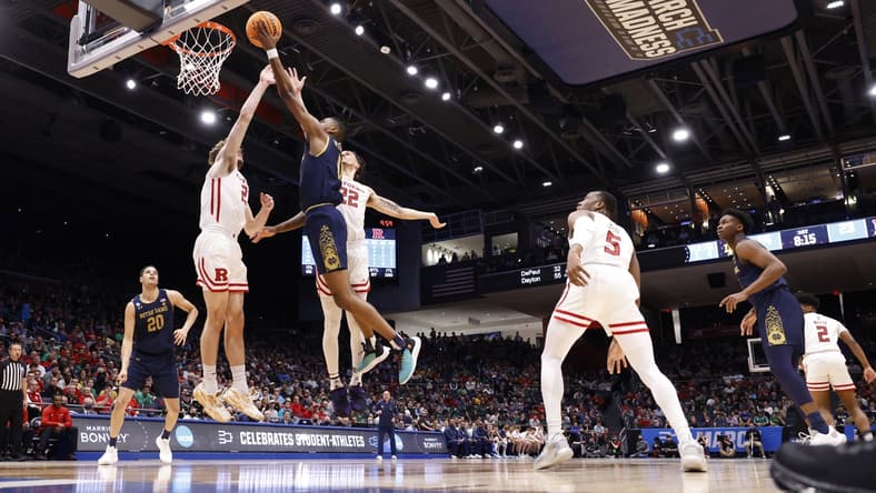 Mar 16, 2022; Dayton, Ohio, USA; Notre Dame Fighting Irish guard Blake Wesley (0) shoots the ball defended by Rutgers Scarlet Knights guard Jalen Miller (2) in the first half at University of Dayton Arena. Mandatory Credit: Rick Osentoski-USA TODAY Sports