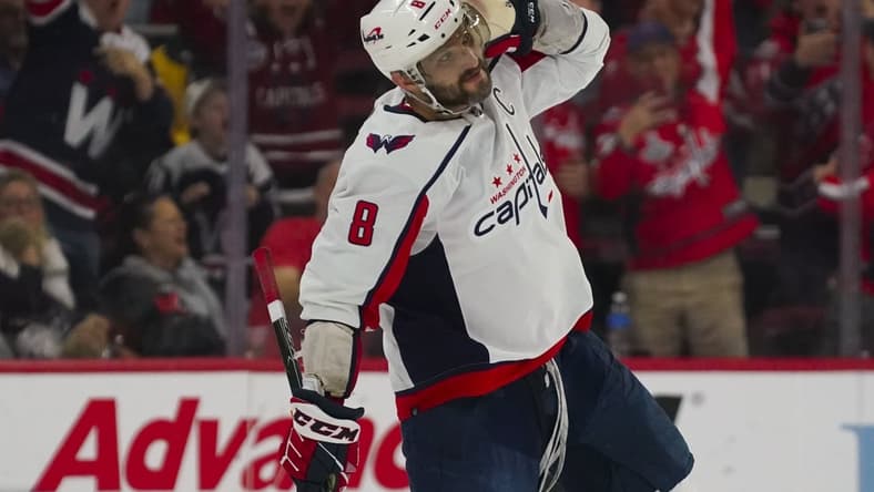 Mar 18, 2022; Raleigh, North Carolina, USA; Washington Capitals left wing Alex Ovechkin (8) reacts after scoring the game winning goal in the shootout against the Carolina Hurricanes at PNC Arena. Mandatory Credit: James Guillory-USA TODAY Sports