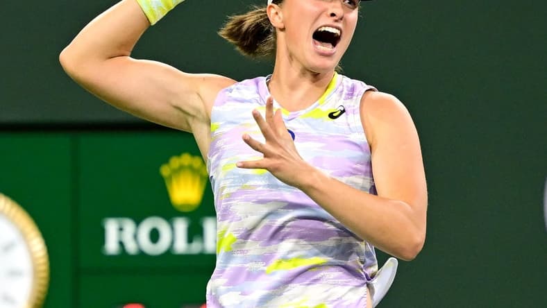 Mar 18, 2022; Indian Wells, CA, USA; Iga Swiatek (ITA) hits a shot as she defeated Simona Halep (ROM) in her semifinal match at the BNP Paribas Open at the Indian Wells Tennis Garden. Mandatory Credit: Jayne Kamin-Oncea-USA TODAY Sports