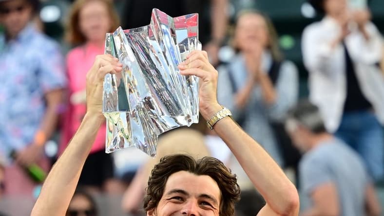 Mar 20, 2022; Indian Wells, CA, USA; Taylor Fritz (USA) holds the championship trophy after defeating Rafael Nadal (ESP) in the men s final at the BNP Paribas Open at the Indian Wells Tennis Garden. Mandatory Credit: Jayne Kamin-Oncea-USA TODAY Sports