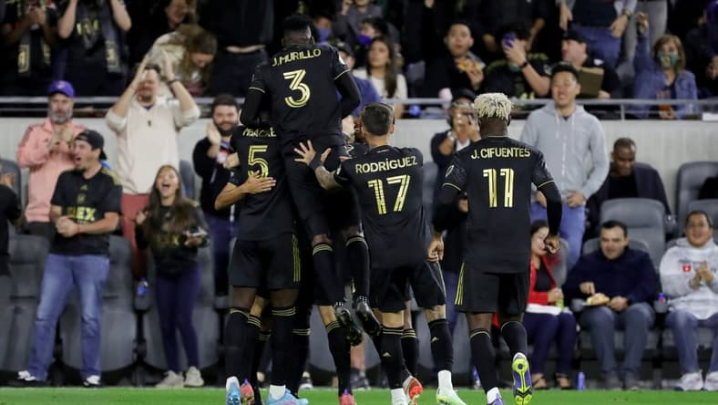Mar 20, 2022; Los Angeles, California, USA; Los Angeles FC defender Jesus Murillo (3) celebrates with teammates after midfielder Ryan Hollingshead (24) scores a goal during the first half against the Vancouver Whitecaps FC at Banc of California Stadium. Mandatory Credit: Kiyoshi Mio-USA TODAY Sports