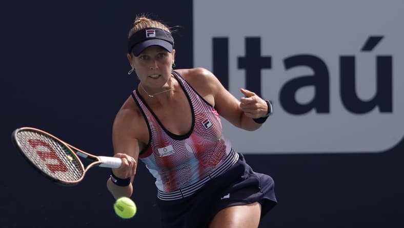 Mar 22, 2022; Miami Gardens, FL, USA; Shelby Rogers of the United States hits a forehand against Amanda Anisimova of the United States (not pictured) in a first round women's singles match in the Miami Open at Hard Rock Stadium. Mandatory Credit: Geoff Burke-USA TODAY Sports