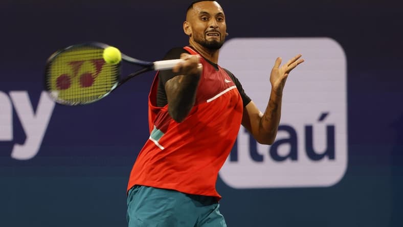 Mar 23, 2022; Miami Gardens, FL, USA; Nick Kyrgios (AUS) hits a forehand against Adrian Mannarino (FRA) (not pictured) in a first round men's singles match in the Miami Open at Hard Rock Stadium. Mandatory Credit: Geoff Burke-USA TODAY Sports