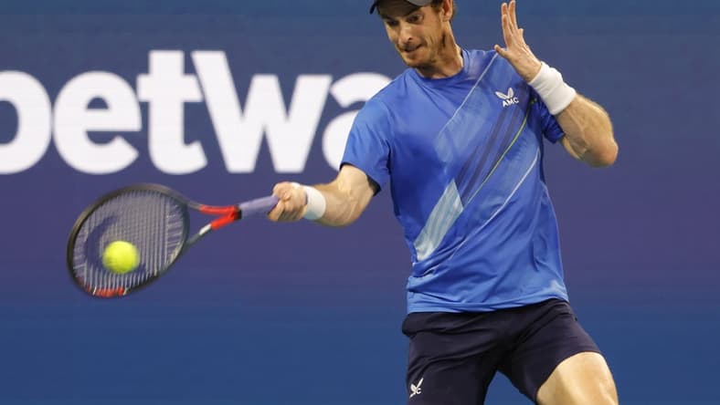 Mar 24, 2022; Miami Gardens, FL, USA; Andy Murray (GBR) hits a forehand against Federico Delbonis (ARG) (not pictured) in a first round men's singles match in the Miami Open at Hard Rock Stadium. Mandatory Credit: Geoff Burke-USA TODAY Sports