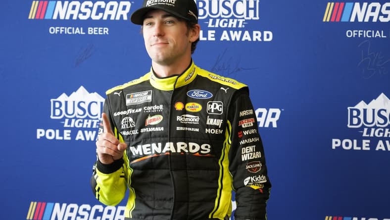 Mar 26, 2022; Austin, Texas, USA; NASCAR Cup Series driver Ryan Blaney (12) poses for photos after winning the pole award during the EchoPark Automotive Texas Grand Prix Qualifying at Circuit of the Americas. Mandatory Credit: Mike Dinovo-USA TODAY Sports