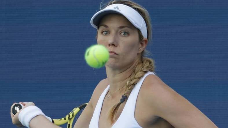 Mar 26, 2022; Miami Gardens, FL, USA; Danielle Collins (USA) follows the ball while hitting a forehand against Vera Zvonareva (not pictured) in a third round women's singles match in the Miami Open at Hard Rock Stadium. Mandatory Credit: Geoff Burke-USA TODAY Sports