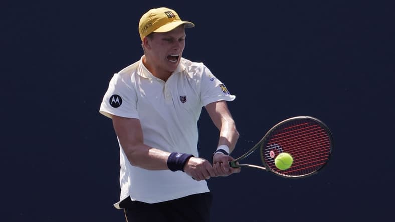 Mar 28, 2022; Miami Gardens, FL, USA; Jenson Brooksby (USA) hits a backhand against Roberto Bautista Agut (ESP)(not pictured) in a third round men's singles match in the Miami Open at Hard Rock Stadium. Mandatory Credit: Geoff Burke-USA TODAY Sports