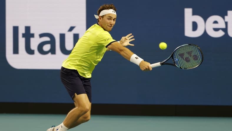 Mar 30, 2022; Miami Gardens, FL, USA; Casper Ruud (NOR) hits a backhand against Alexander Zverev (GER)(not pictured) in a men's singles quarterfinal match in the Miami Open at Hard Rock Stadium. Mandatory Credit: Geoff Burke-USA TODAY Sports