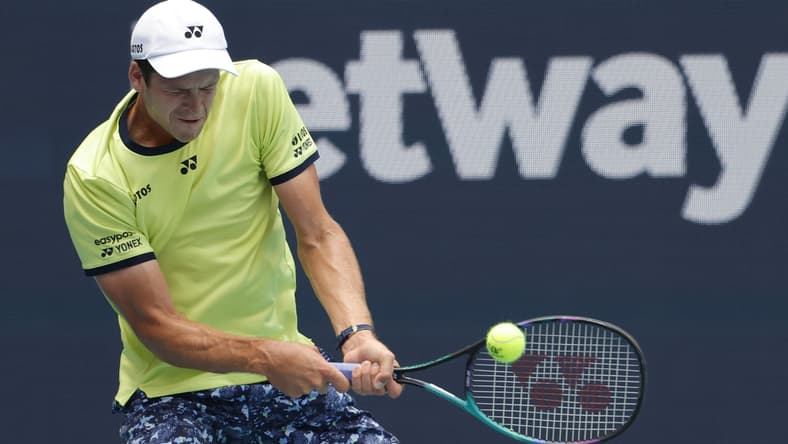 Mar 31, 2022; Miami Gardens, FL, USA; Hubert Hurkacz (POL) hits a backhand against Daniil Medvedev (not pictured) in a men's singles quarterfinal in the Miami Open at Hard Rock Stadium. Mandatory Credit: Geoff Burke-USA TODAY Sports