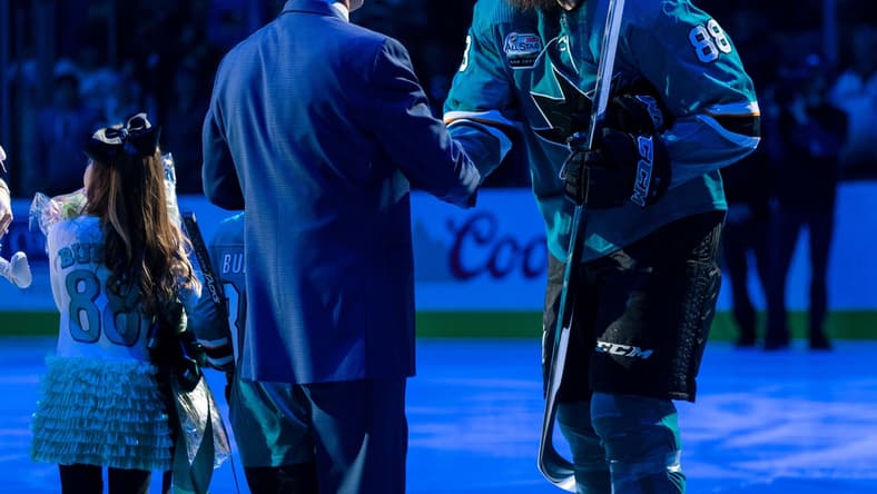 Jan 12, 2019; San Jose, CA, USA; San Jose Sharks general manager Doug Wilson congratulates San Jose Sharks defenseman Brent Burns (88) in a ceremony commemorating Burns playing 1000 games before the game against the Ottawa Senators at SAP Center at San Jose. Mandatory Credit: John Hefti-USA TODAY Sports