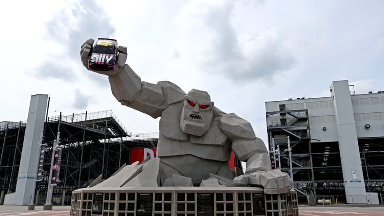 Aug 22, 2020; Dover, Delaware, USA; The statue of "Miles the Monster" out of Dover International Speedway hold a car of NASCAR Cup Series driver Jimmie Johnson (not pictured) before the NASCAR Cup Series race. Mandatory Credit: Peter Casey-USA TODAY Sports