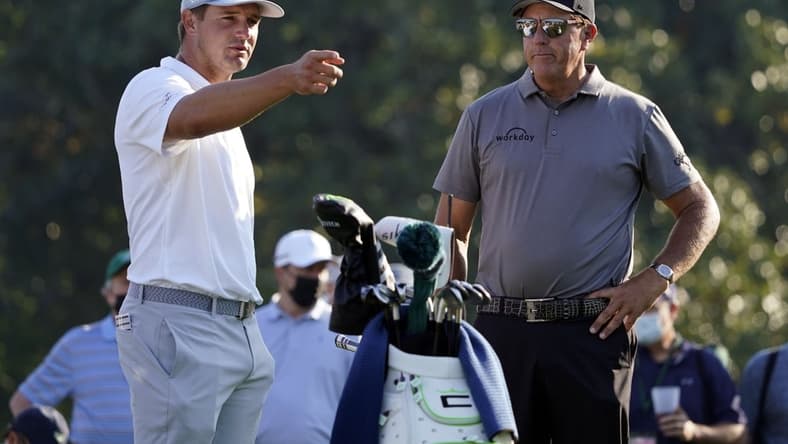 Apr 7, 2021; Augusta, GA, USA; Bryson DeChambeau (left) and Phil Mickelson (right) on the 10th tee during a practice round for The Masters golf tournament at Augusta National Golf Club. Mandatory Credit: Michael Madrid-USA TODAY Sports