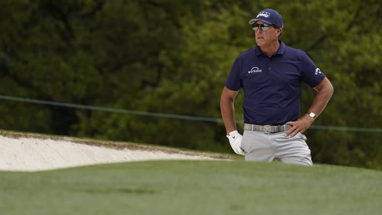 Apr 8, 2021; Augusta, Georgia, USA; Phil Mickelson looks out from a bunker on the 1st hole during the first round of The Masters golf tournament. Mandatory Credit: Rob Schumacher-USA TODAY Sports