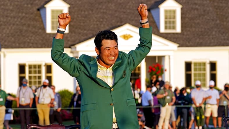 Apr 11, 2021; Augusta, Georgia, USA; Hideki Matsuyama celebrates with the green jacket after winning The Masters golf tournament. Mandatory Credit: Rob Schumacher-USA TODAY Sports