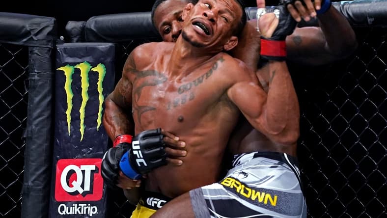 Apr 24, 2021; Jacksonville, Florida, USA; Alex Oliveira (Red Gloves) fights Randy Brown (Blue Gloves) during UFC 261 at VyStar Veterans Memorial Arena. Mandatory Credit: Jasen Vinlove-USA TODAY Sports