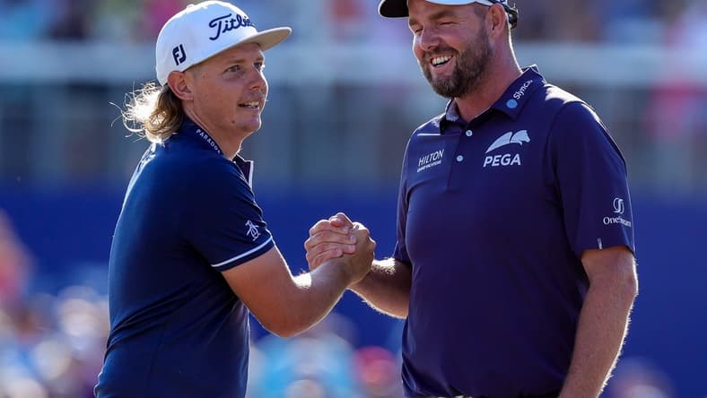 Apr 25, 2021; Avondale, Louisiana, USA; Cameron Smith shakes hands with Marc Leishman after winning the final round round of the Zurich Classic of New Orleans golf tournament. Mandatory Credit: Stephen Lew-USA TODAY Sports