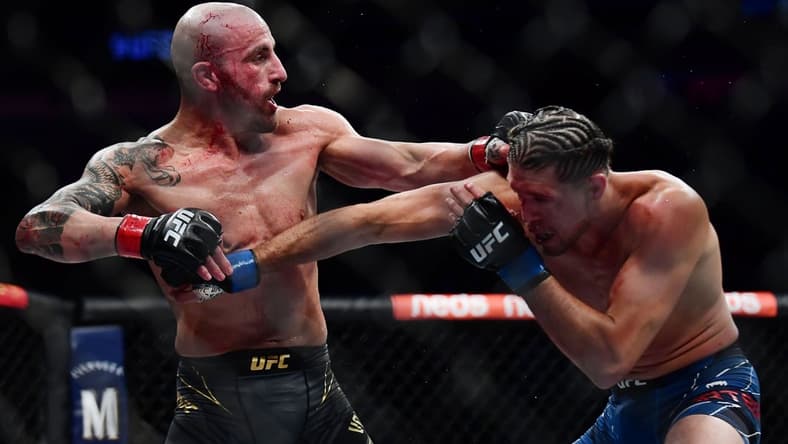 Sep 25, 2021; Las Vegas, Nevada, USA; Brian Ortega lands a hit against Alexander Volkanovski during UFC 266 at T-Mobile Arena. Mandatory Credit: Gary A. Vasquez-USA TODAY Sports