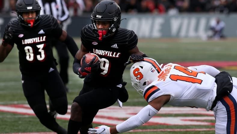 Louisville's Tyler Harrell makes Syracuse's Jason Simmons miss the tackle after he catches the ball and then runs for a touchdown. Nov. 13, 2021 Louisville Syracuse 18