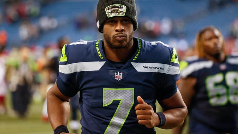 Nov 21, 2021; Seattle, Washington, USA; Seattle Seahawks quarterback Geno Smith (7) jogs to the locker room following a 23-13 loss against the Arizona Cardinals at Lumen Field. Mandatory Credit: Joe Nicholson-USA TODAY Sports