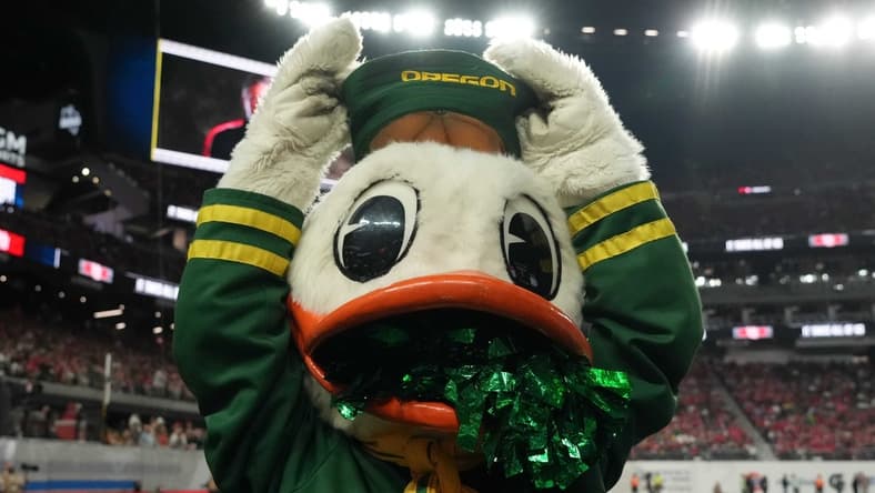Dec 3, 2021; Las Vegas, NV, USA; Oregon Ducks mascot Puddles poses against the Utah Utes in the second half during the 2021 Pac-12 Championship Game at Allegiant Stadium.Utah defeated Oregon 38-10.  Mandatory Credit: Kirby Lee-USA TODAY Sports