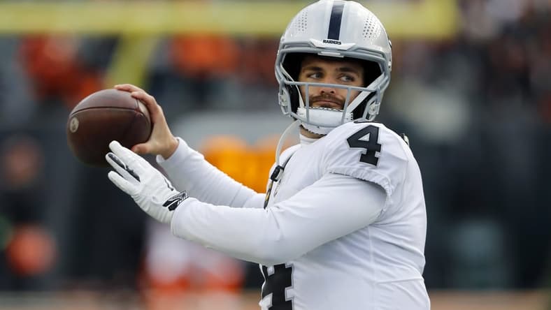Jan 15, 2022; Cincinnati, Ohio, USA; Las Vegas Raiders quarterback Derek Carr (4) warms up before the AFC Wild Card playoff football game against the Cincinnati Bengals at Paul Brown Stadium. Mandatory Credit: Joseph Maiorana-USA TODAY Sports