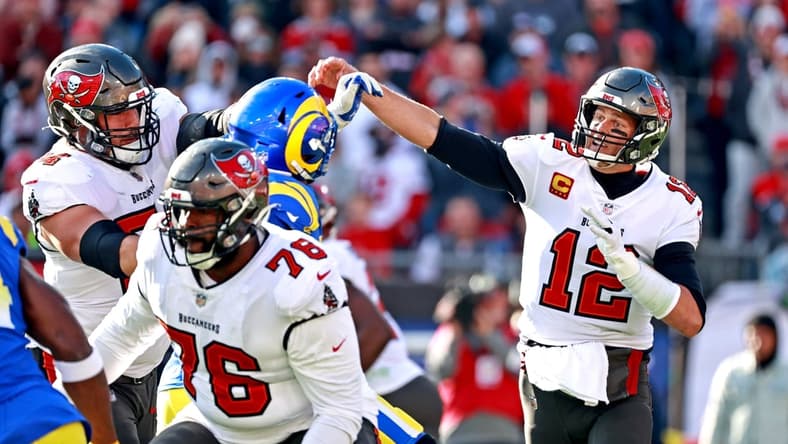 Jan 23, 2022; Tampa, Florida, USA; Tampa Bay Buccaneers quarterback Tom Brady (12) throws a pass during the first half against the Los Angeles Rams in a NFC Divisional playoff football game at Raymond James Stadium. Mandatory Credit: Matt Pendleton-USA TODAY Sports