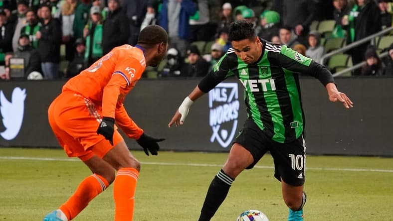 Feb 26, 2022; Austin, Texas, USA; Austin FC forward Cecilio Dominguez (10) dribbles the ball against FC Cincinnati Raymon Gaddis (28) during the second half at Q2 Stadium. Austin FC won 5-0. Mandatory Credit: Scott Wachter-USA TODAY Sports
