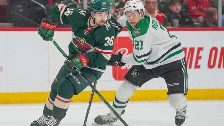 Mar 6, 2022; Saint Paul, Minnesota, USA; Minnesota Wild right wing Mats Zuccarello (36) and Dallas Stars left wing Jason Robertson (21) at Xcel Energy Center. Mandatory Credit: Matt Blewett-USA TODAY Sports