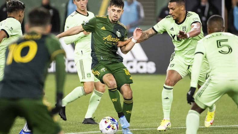 Mar 12, 2022; Portland, Oregon, USA; Austin FC defender Ruben Gabrielsen (4) defends Portland Timbers forward Diego Gutierrez (16) during the second half at Providence Park. The Timbers won the game 1-0. Mandatory Credit: Troy Wayrynen-USA TODAY Sports