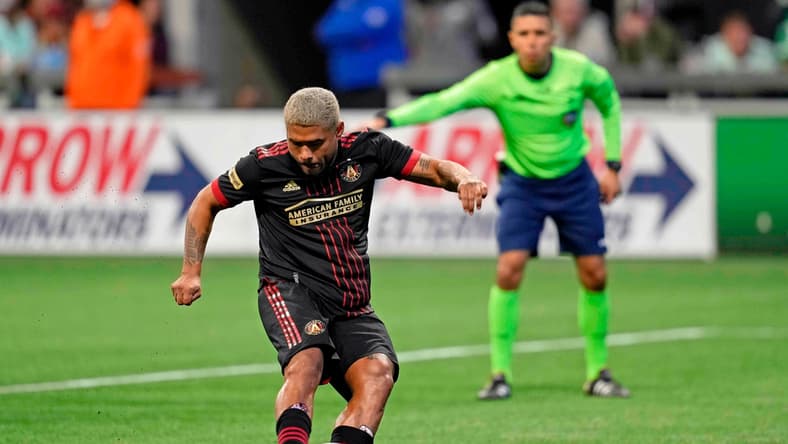 Mar 13, 2022; Atlanta, Georgia, USA; Atlanta United forward Josef Martinez (7) scores on a penalty kick against Charlotte FC during the second half at Mercedes-Benz Stadium. Atlanta United won 2-1. Mandatory Credit: Dale Zanine-USA TODAY Sports