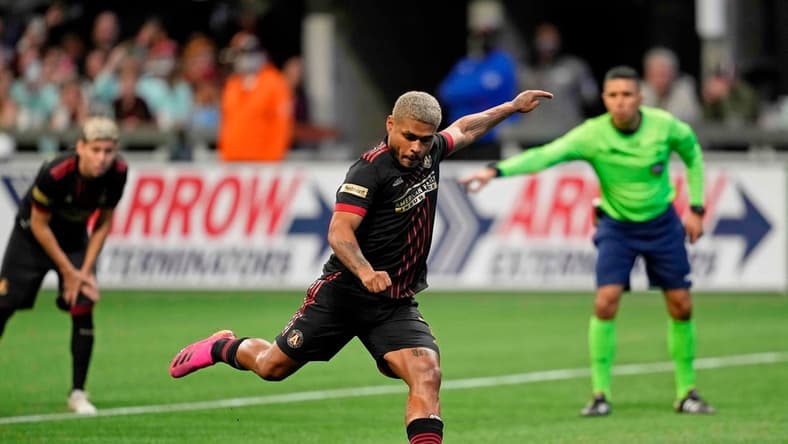 Mar 13, 2022; Atlanta, Georgia, USA; Atlanta United forward Josef Martinez (7) scores on a penalty kick against Charlotte FC during the second half at Mercedes-Benz Stadium. Atlanta United won 2-1. Mandatory Credit: Dale Zanine-USA TODAY Sports